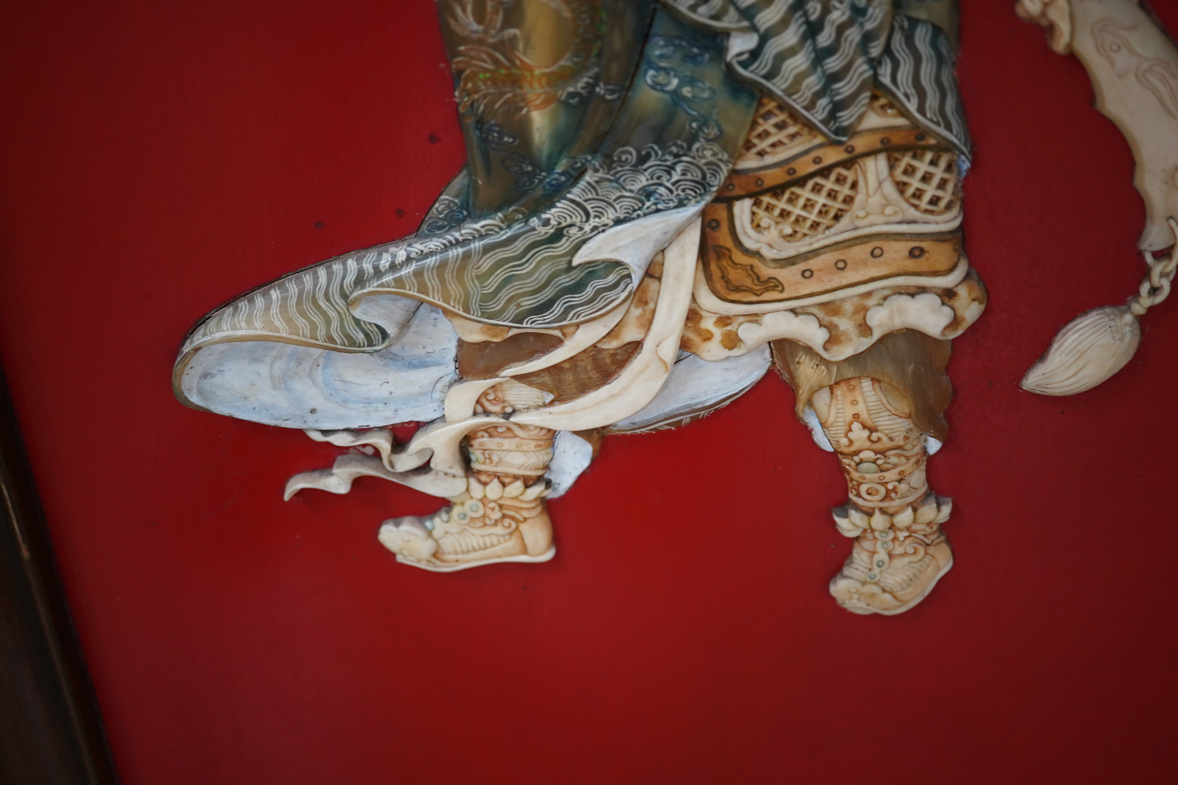 Four large Chinese lacquer and bone mounted relief panels depicting warriors, each 99cm high. Condition - fair to good